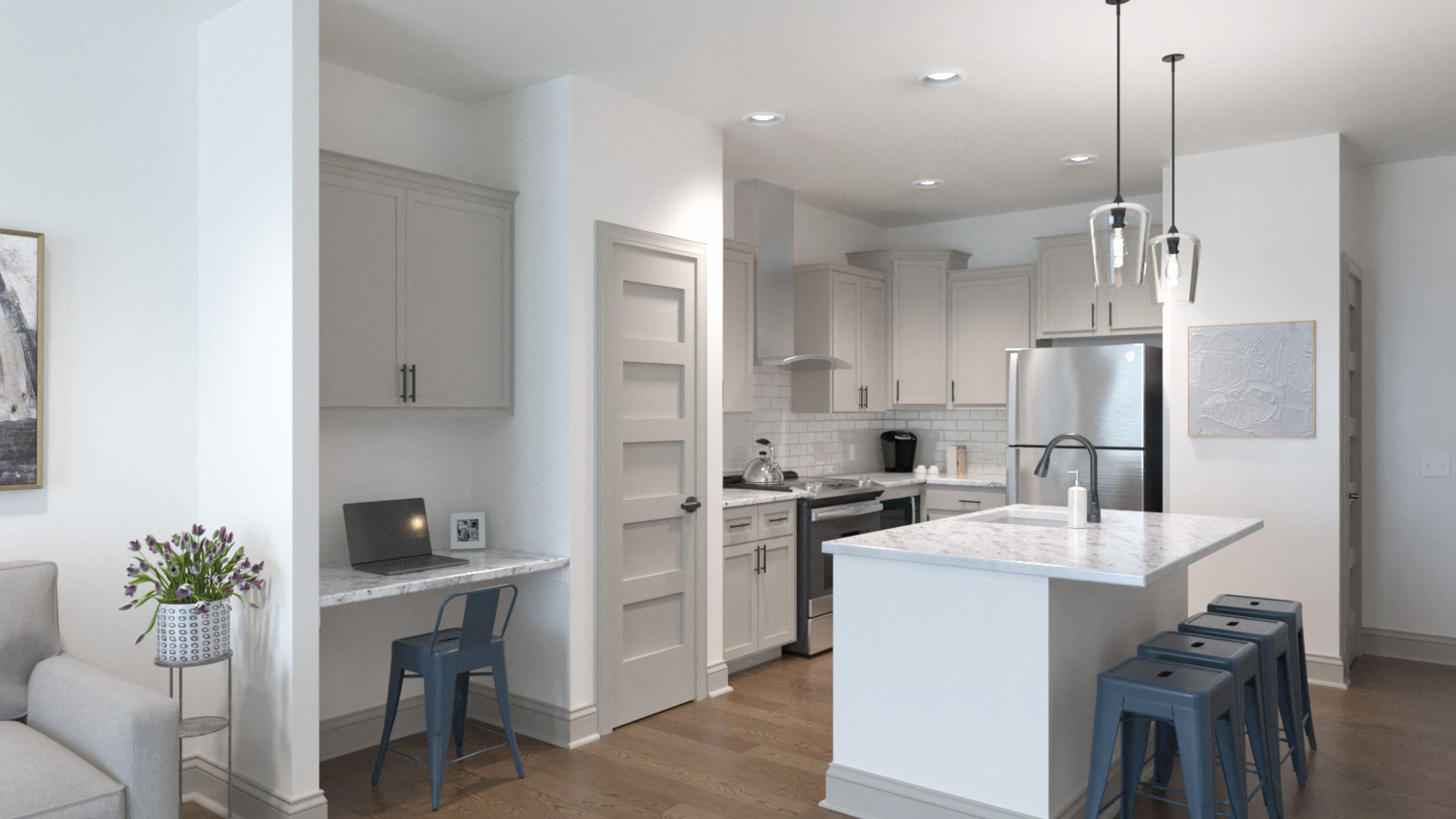 Hawthorne at Holbrook apartment living space and kitchen with small dining table, kitchen peninsula, and stainless steel appliances